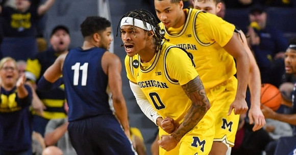Dug McDaniel (0) and Jett Howard (13)