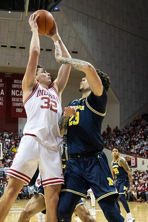 Brandon Johns Jr. (23) and Eli Brooks (55)