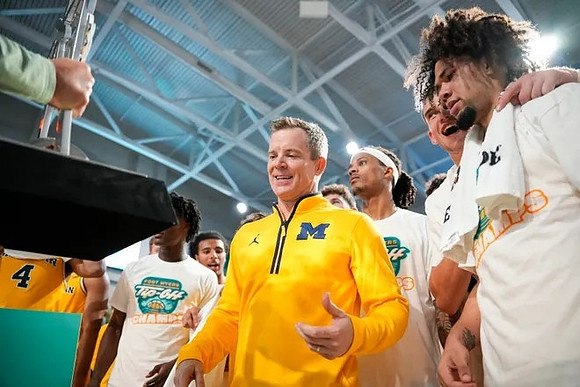 Dusty May, Michigan Team, and Fort Myers Tip-Off Championship Trophy