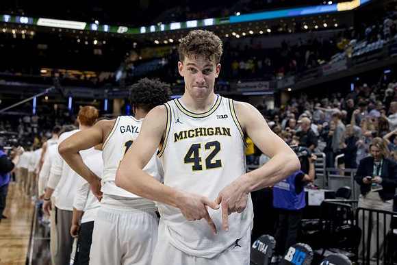 Will Tschetter (42) and Michigan Team