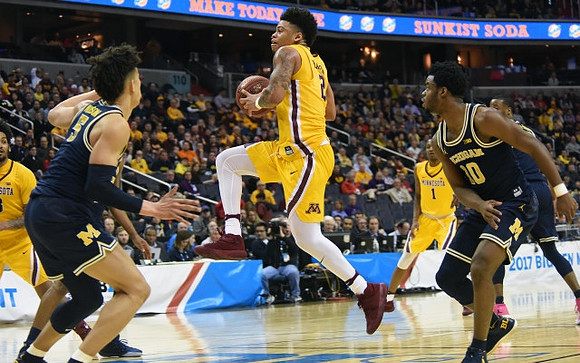 D.J. Wilson (5), Derrick Walton Jr. (10), and Muhammad-Ali Abdur-Rahkman (12)