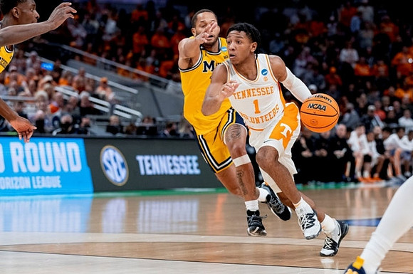 Moussa Diabate (14) and DeVante' Jones (12)