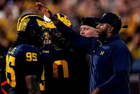 Trey Pierce (95), Tré Williams (0), Lou Esposito, and Sherrone Moore