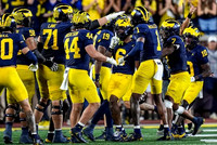 Brandyn Hillman (6) and Michigan Team