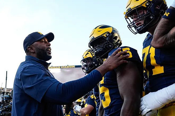 Sherrone Moore and Michigan Team