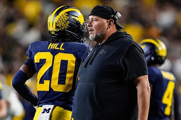 Jyaire Hill (20) and Lou Esposito