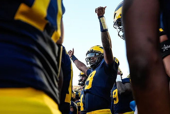 Bryce Underwood (19) and Michigan Team