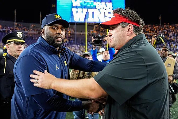 Sherrone Moore and New Mexico Head Coach Jason Eck