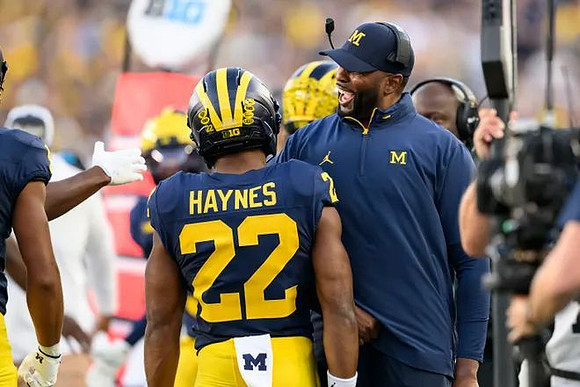Justice Haynes (22) and Sherrone Moore