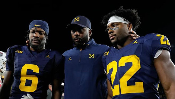 Brandyn Hillman (6), Sherrone Moore, and Justice Haynes (22)