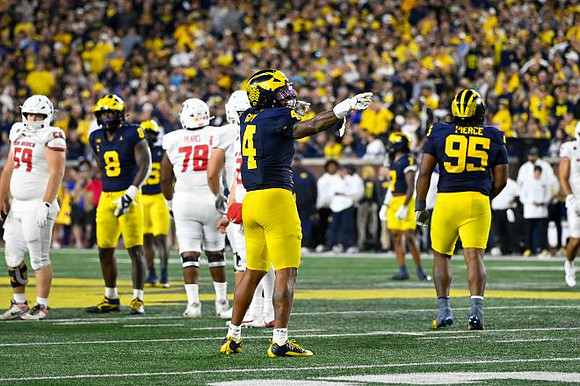 Derrick Moore (8), TJ Guy (4), and Trey Pierce (95)