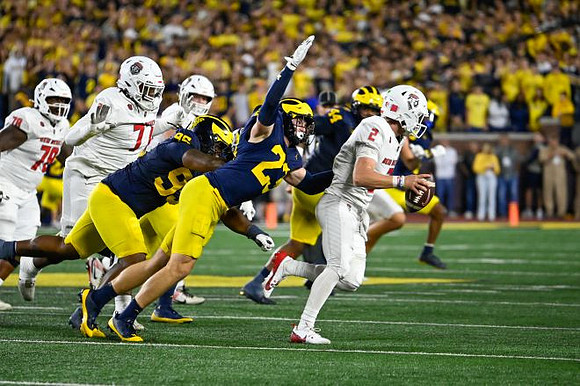 Trey Pierce (95), Cole Sullivan (23), and Damon Payne (44)