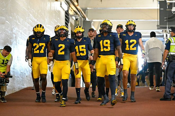 Bryce Underwood (19) and Michigan Team