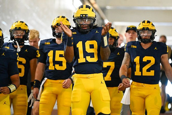 Bryce Underwood (19) and Michigan Team