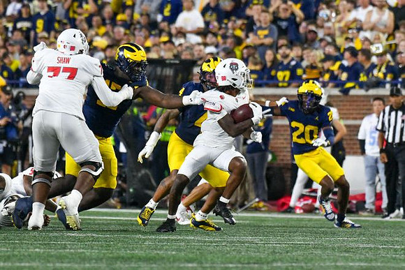 Enow Etta (17), TJ Guy (4), and Jyaire Hill (20)