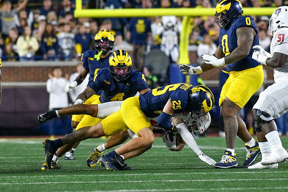 TJ Guy (4), Mason Curtis (25), and Tré Williams (0)