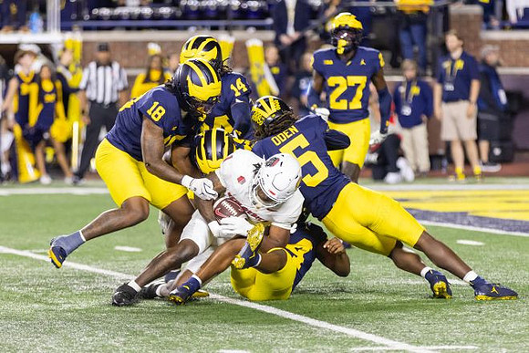 Troy Bowles (18), Jacob Oden (5), and Jayden Sanders (27)