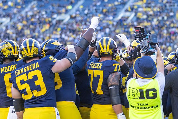Derrick Moore (8), Jake Guarnera (53), and Blake Frazier (77)