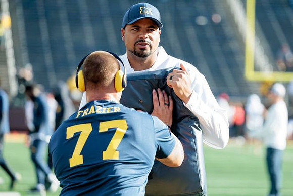 Blake Frazier (77) and Grant Newsome