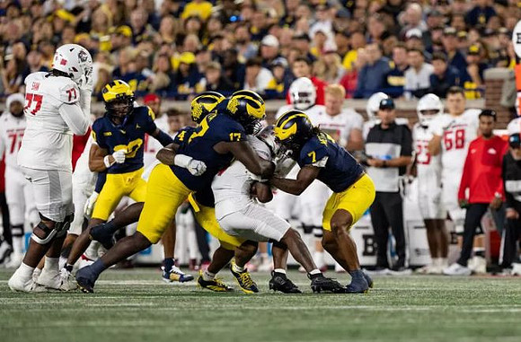 TJ Guy (4), Enow Etta (17), TJ Metcalf (7), and Jyaire Hill (20)