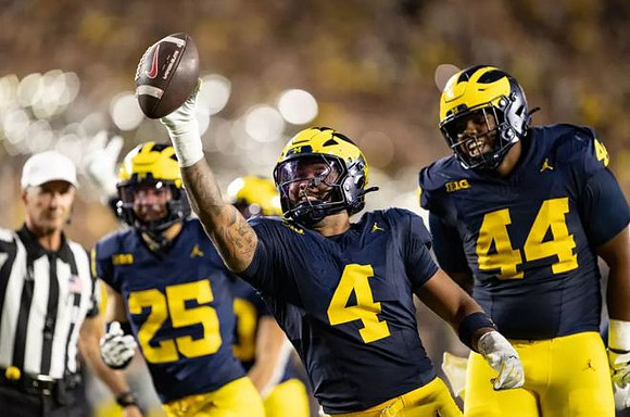 Mason Curtis (25), TJ Guy (4), and Damon Payne (44)