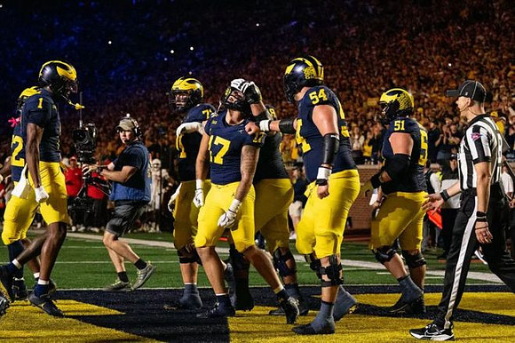 Marlin Klein (17) and Michigan Team
