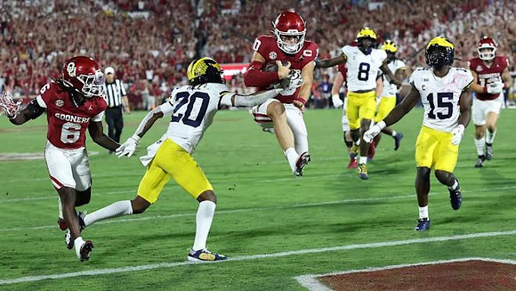Jyaire Hill (20), Derrick Moore (8), and Ernest Hausmann (15)