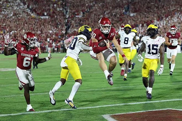 Jyaire Hill (20), Derrick Moore (8), and Ernest Hausmann (15)