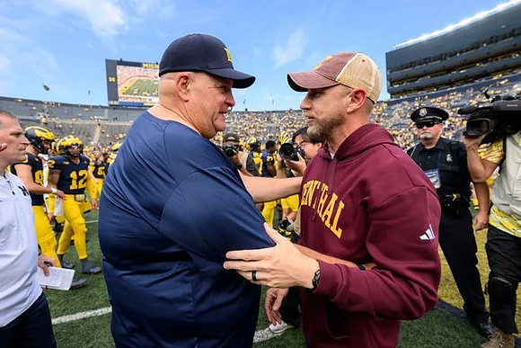 Acting Head Coach Biff Poggi and Central Michigan Head Coach Matt Drinkall