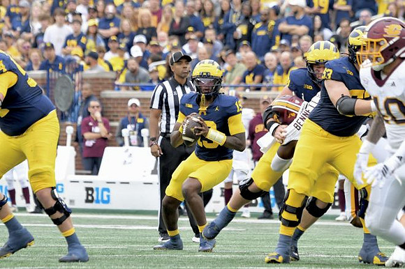 Bryce Underwood (19) and Jake Guarnera (53)