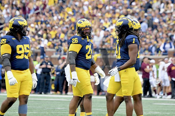 Trey Pierce (95), Rayshaun Benny (26), and Jaishawn Barham (1)