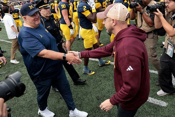 Acting Head Coach Biff Poggi and Central Michigan Head Coach Matt Drinkall
