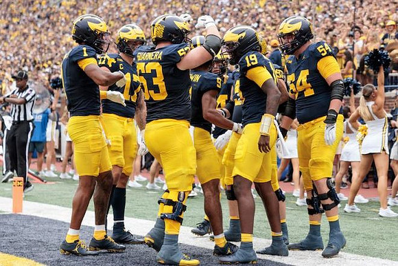 Bryce Underwood (19) and Michigan Team