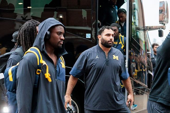 Giovanni El-Hadi (58) and Michigan Team