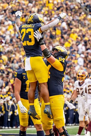 Jordan Marshall (23), Evan Link (71), and Andrew Sprague (54)