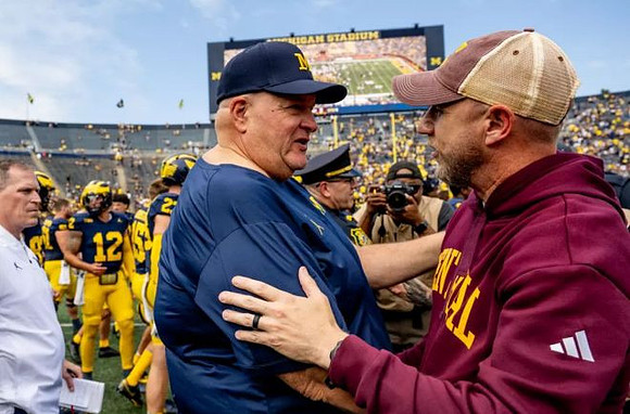 Acting Head Coach Biff Poggi and Central Michigan Head Coach Matt Drinkall