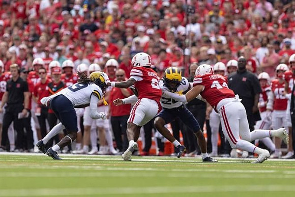 Cameron Brandt (9) and Jyaire Hill (20)