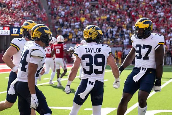 Bryson Kuzdzal (24), Joe Taylor (39), and Chibi Anwunah (97)