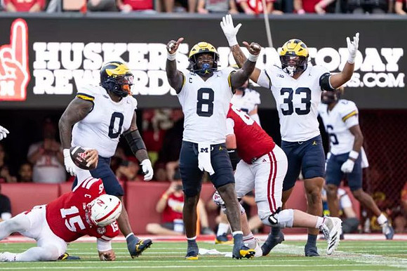Tré Williams (0), Derrick Moore (8), Dominic Nichols (33), and Brandyn Hillman (6)