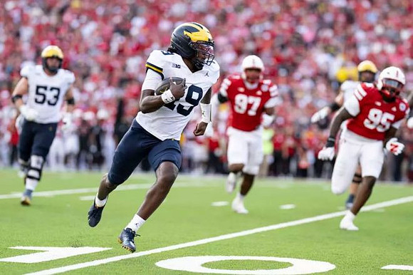 Jake Guarnera (53) and Bryce Underwood (19)