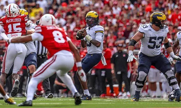 Bryce Underwood (19) and Jake Guarnera (53)