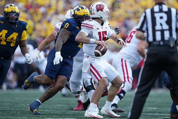 Damon Payne (44) and Tré Williams (0)