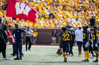 Justice Haynes (22) and Michigan Team