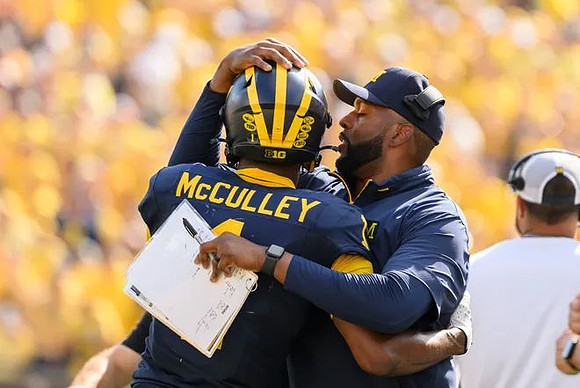 Donaven McCulley (1) and Sherrone Moore