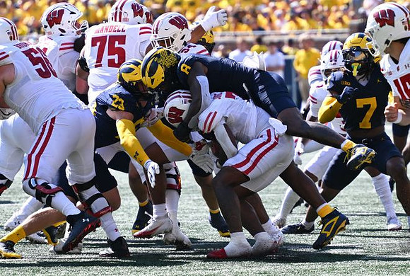 Cole Sullivan (23), Derrick Moore (8), and TJ Metcalf (7)