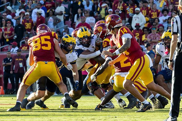 Jordan Young (14), Brandyn Hillman (6), and Dominic Nichols (33)