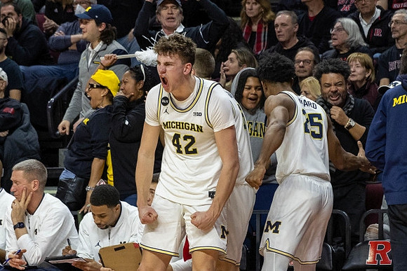 Will Tschetter (42) and Michigan Team