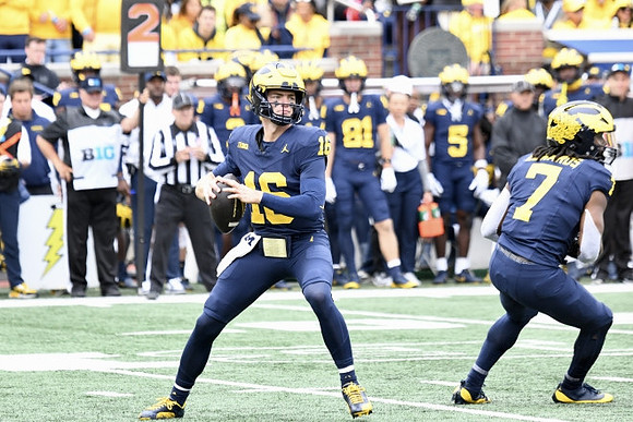 Davis Warren (16) and Donovan Edwards (7)