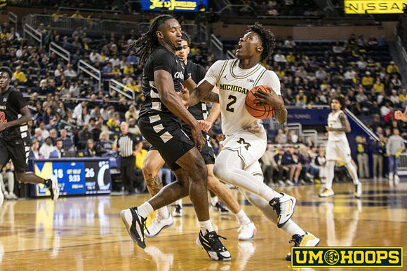 L.J. Cason (2) and Elliot Cadeau (3)