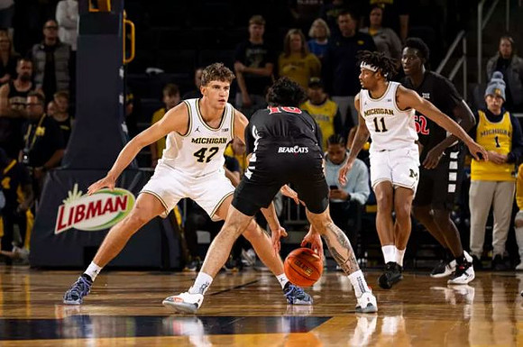 Will Tschetter (42) and Roddy Gayle Jr. (11)